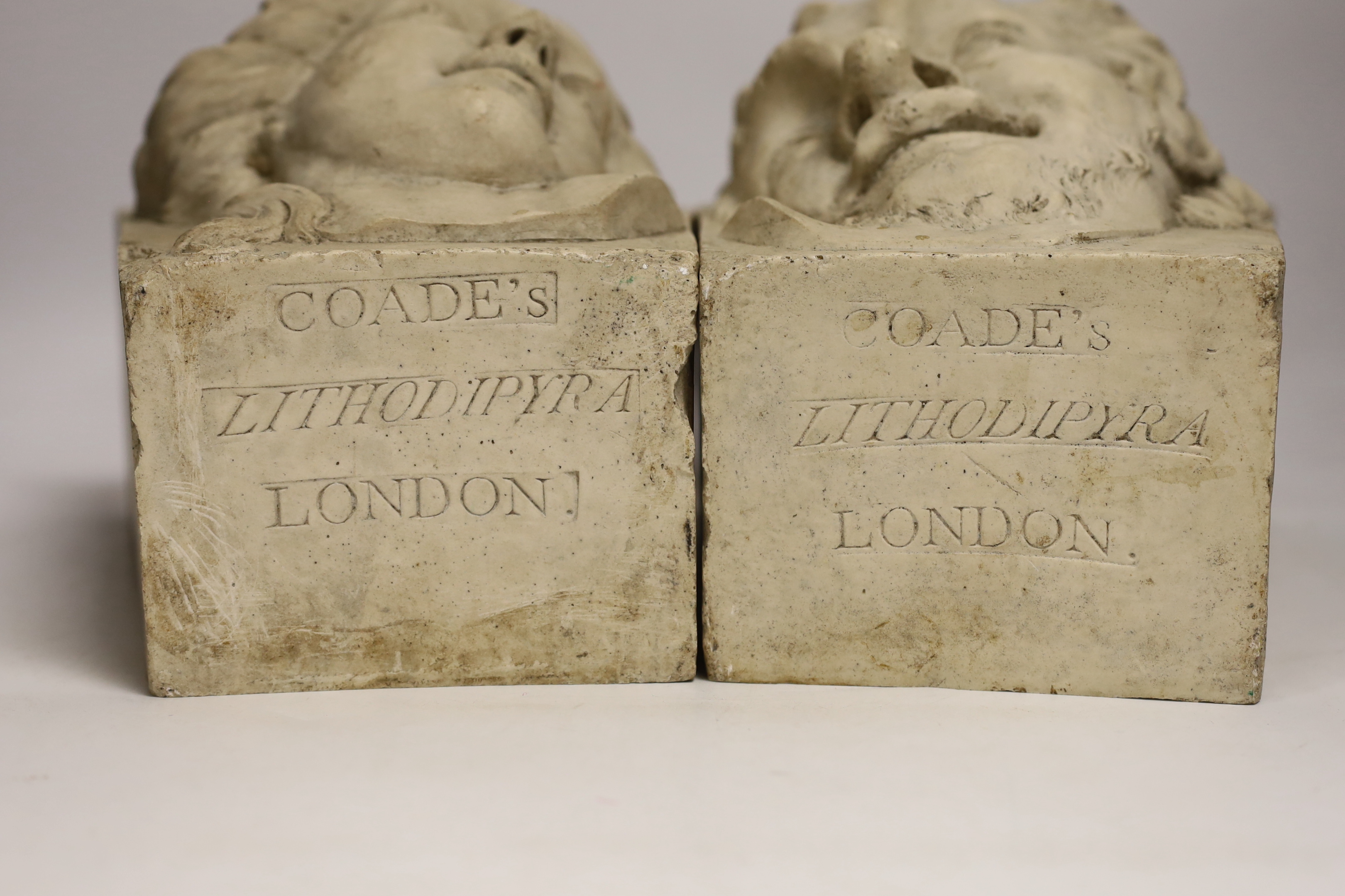A pair of cast resin key stones, the underside reads COADE’S Lithodipyra LONDON, 25cm